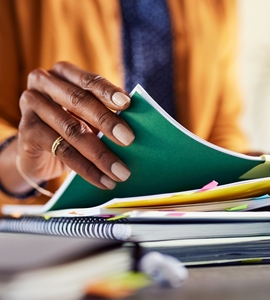 Employee,Woman,Hand,Checking,Documents,In,Stacks,Of,Paper,Files